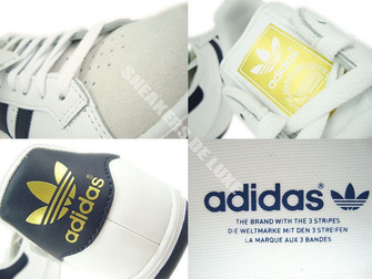 G64079 adidas Grand Prix White / New Navy / Metallic Gold